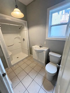 Bathroom with shower, sink and toilet