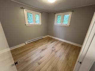 Main-floor bedroom with two windows